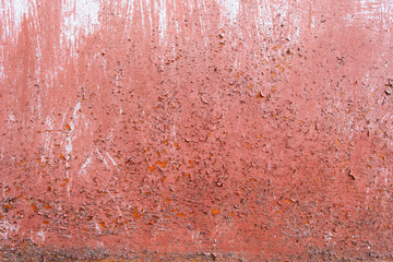 Rusting metal surface. Texture of worn and rusty metal surface with remains of several layers of red paint, high resolution.