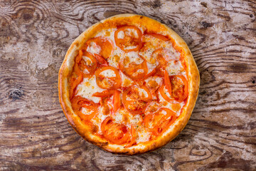 Pizza with tomatoes and cheese
