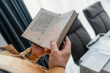 hands of a person with a book