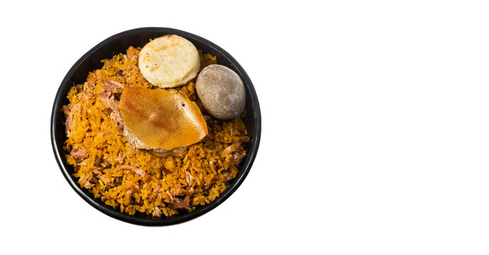 Suckling pig with rice, potato, arepa - Typical Colombian gastronomy