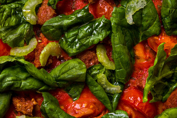 Pizza with basil, spinach, asparagus peppers, tomatoes and sauce