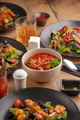 Gourmet meat meals assortment flat lay. Top view on restaurant table with menu of tasty grilled snacks. Concept for restaurant menu.