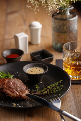 Gourmet meat meals assortment flat lay. Top view on restaurant table with menu of tasty grilled snacks. Concept for restaurant menu.