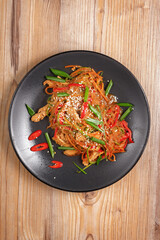 traditional dishes of European cuisine, delicacy, banquet snack. culinary dishes on a black plate on a wood background. restaurant service. top view