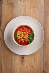 traditional dishes of European cuisine, delicacy, banquet snack. culinary dishes on a white plate on a wood background. restaurant service. top view