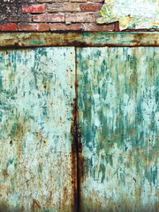 Worn damaged metallic gate