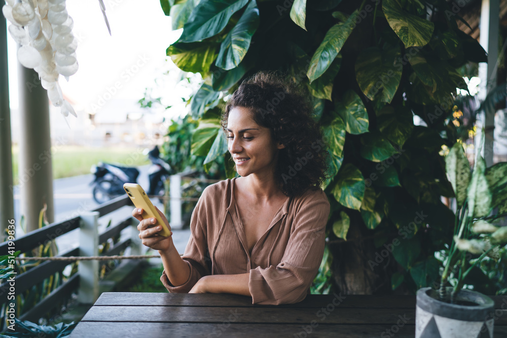 Aufkleber happy female blogger reading received email message on cellular device using 4g internet for network