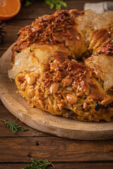 Bolo rainha or queen's cake is a traditional portuguese Xmas cake with fruits raisins nut on kitchen countertop. Served with orange tea. Is made for Christmas, Carnavale or Mardi Gras