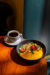 Pumpkin porridge with strawberries, apple, mint, avocado
