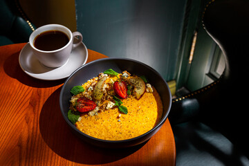 Pumpkin porridge with strawberries, apple, mint, avocado
