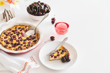Plate with tasty cherry cheesecake pie on white background. Copy space