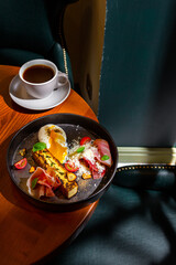 Pumpkin porridge with strawberries, apple, mint, avocado