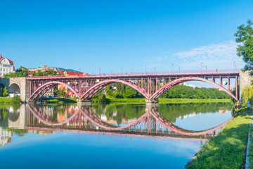 Maribor, Slovenia - June 2, 2022: Main Bridge (Glavni most) or Old Bridge (Slovene: Stari most) over Drava river in Maribor.