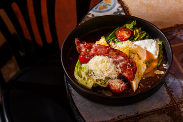 Salad with fried meat, fried chicken cutlet, boiled egg, tomatoes, parmesan