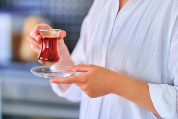 Obraz na płótnie Canvas Female drinking traditional turkish tea
