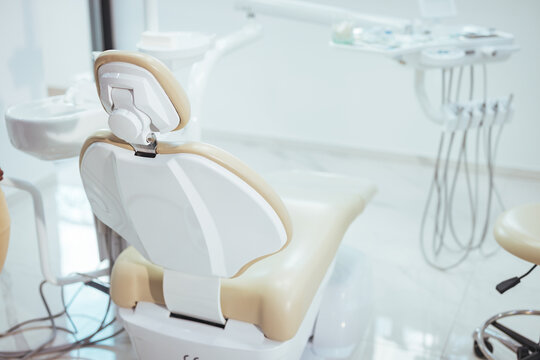 Dentistry, medicine, medical equipment and stomatology concept - interior of new modern dental clinic office with chair. Interior of the office of patients reception with dental equipment