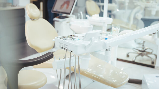 Modern dental practice. Dental chair and other accessories used by dentists. Dental chair and equipment. Patient reception room in a modern medical center.