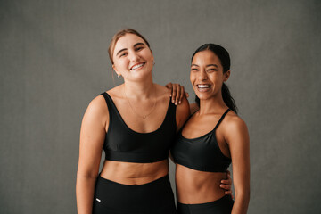 Two Girlfriends very happy and standing there sportswear