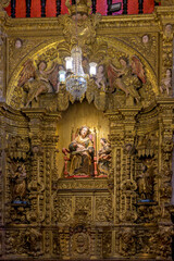 Obraz premium Interior of a baroque church decorated with images of saints and walls with gold leaf ornaments in the historic city of Ouro Preto, Minas Gerais