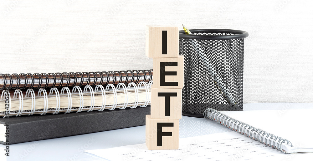 Aufkleber ietf internet engineering task force text on wooden block with notebooks on white background