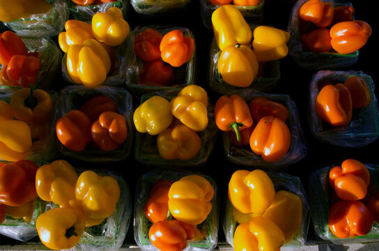 Orange and yellow peppers at farmer's market.