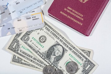 american dollars, flight tickets  and a passport