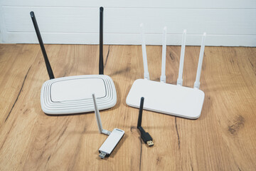 Different types of Wi-Fi routers, modern and old technology. Wireless ethernet connection signal....