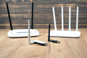 Different types of Wi-Fi routers, modern and old technology. Wireless ethernet connection signal....