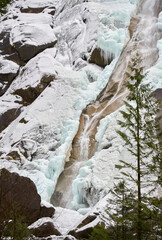 Icy Waterfall Wall vertical. Shannon Falls spray and ice in winter. Located near Squamish north of Vancouver. British Columbia, Canada. 

