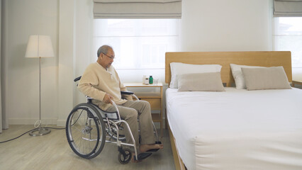 Fototapeta na wymiar Old Asian lonely senior elderly patient man with bed in bedroom isolated in home or house in medical and healthcare. People lifestyle. Disability therapy. Alone