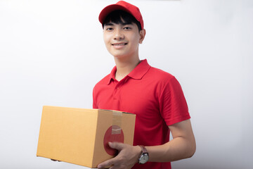 A delivery man carries a cardboard box with a smile. service con