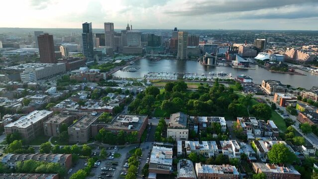Federal Hill in South Baltimore. Aerial view of Inner Harbor at sunset. Dramatic golden hour light.