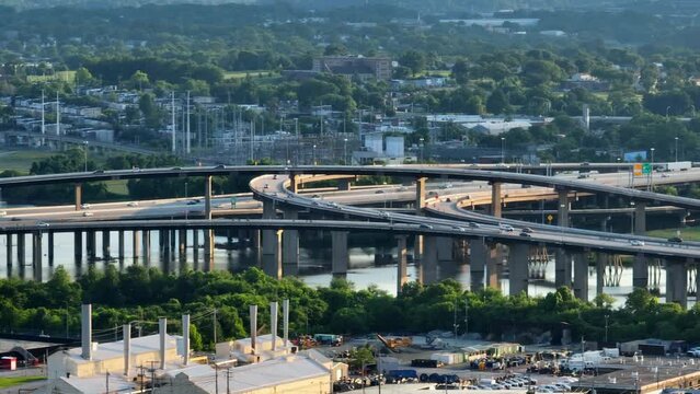 Traffic flows on interstate highway. Interstate 95 around Baltimore Washington region. Long aerial zoom.