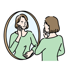 鏡を見て笑顔の女性
