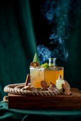 Coctail with cinnamon and citra juce. smoke
