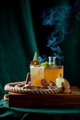 Coctail with cinnamon and citra juce. smoke