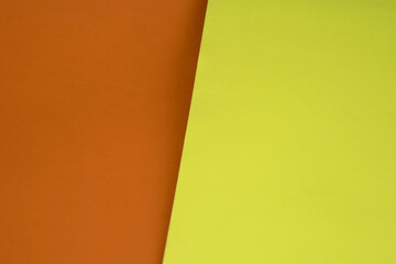 Dark vs light abstract Background with plain subtle smooth de saturated orange brown yellow colours parted into two