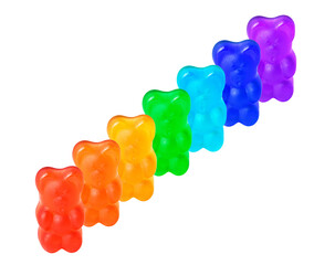 Row of rainbow-colored gummy bears on white
