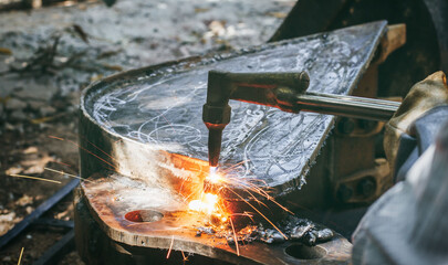 Close up hand heavy industrial worker is working on metal work factory process by Cutting sheet...