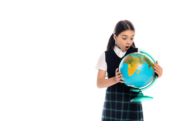 Amazed preteen pupil looking at globe isolated on white.
