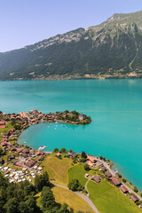 Naklejka premium High view over the village of Inseltwald at the turquoise Brienz Lake in Switzerland.