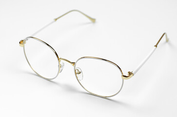 Fototapeta na wymiar Stylish eyeglasses on a white background. Iron frame glasses
