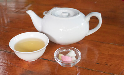 white teapot and bowl on a table in a cafe