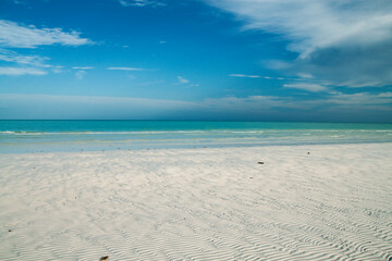 Fototapeta na wymiar Beautiful landscape of empty tropical white sand beach on Holbox Island in the Mexican state of Quintana Roo, Yucatán Peninsula, Gulf Coast of México.