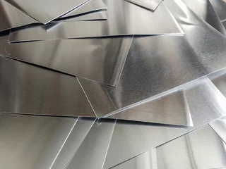 Foto op Canvas aluminum metal sheets. industrial metal pile, production rectangular pieces  © aulia sailan ilma