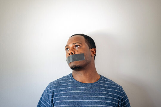 Silence Or Free Speech Concept, African American Or Black Man With Tape On Mouth