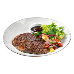 Isolated plate of grilled beef steak with salad and sauce