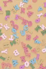 Multicolored letters on a yellow background.