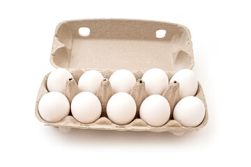Top view of a ten chicken eggs in cardboard package isolated on white