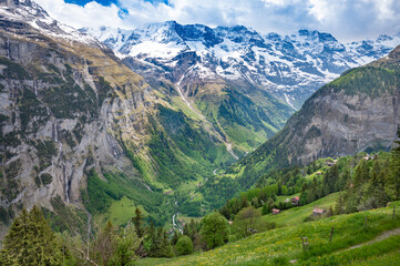 Fototapeta na wymiar Landscape of Lauterbrunnen valley in Swiss Alps, Switzerland. Hiking trail from Murren to Gimmelwald.